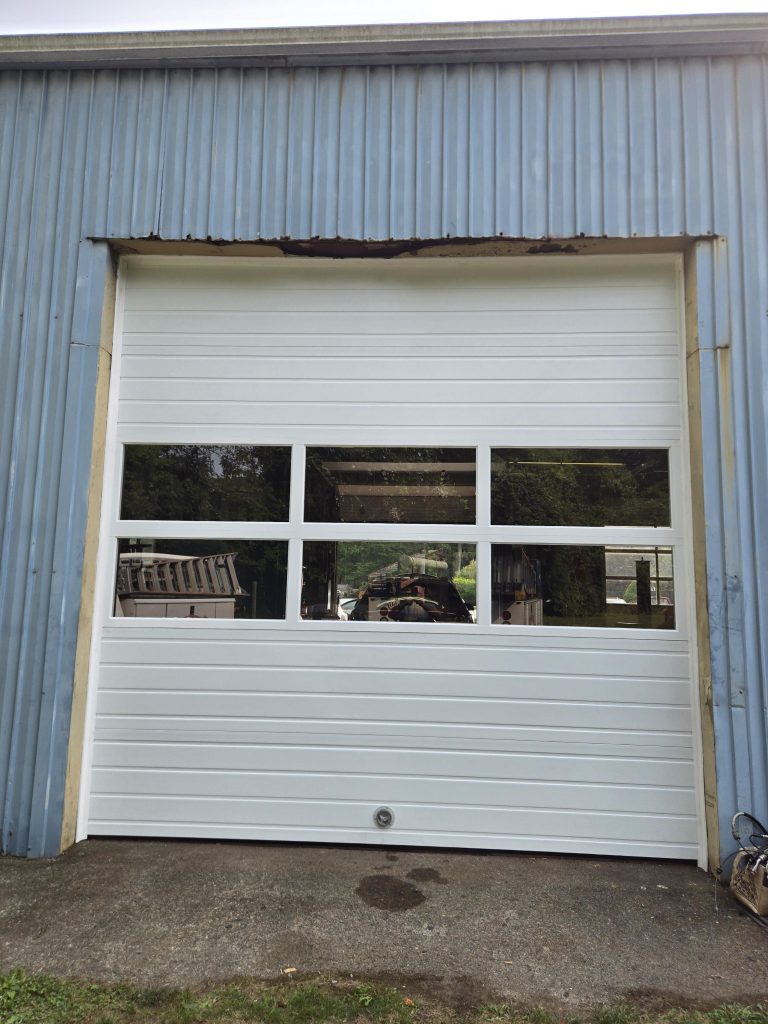 New Garage Door with Full View Aluminum Panels.